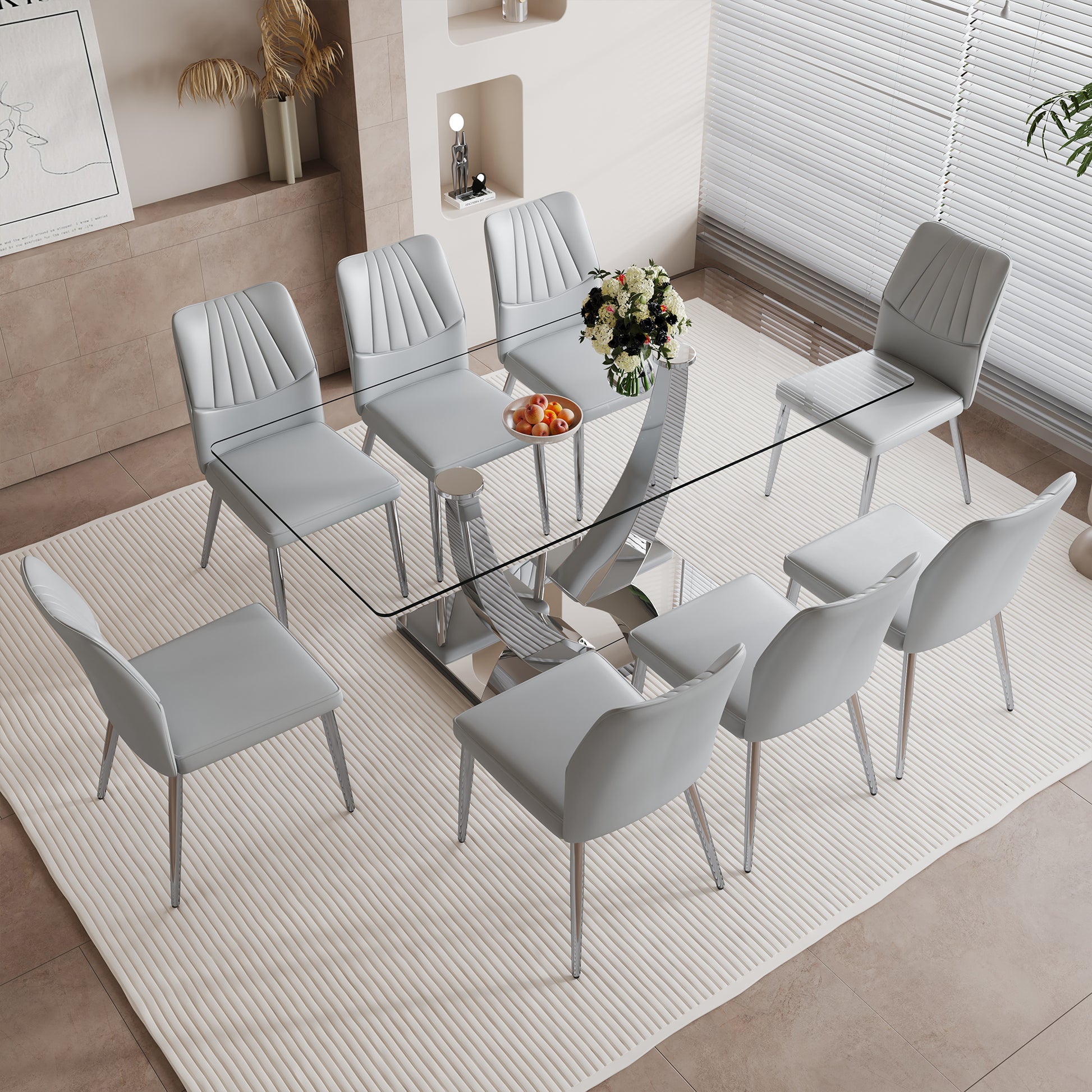 Table And Chair Set.Contemporary, Minimalist Rectangular Dining Table Featuring A Clear Tempered Glass Top And Sleek Silver Legs. Paried With Chairs Made Of Pu Material Cushion And Silver Metal Legs. Light Gray Seats 8 Glass Metal