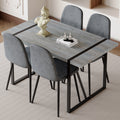 Table And Chair Set. A Minimalist Retro Rectangular Dining Table With A Specially Textured Top And Black Metal Legs, Paired With 4 Soft Chairs And Black Metal Legs, Showcases A Beautiful Home Style.