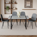 Table And Chair Set. A Minimalist Retro Rectangular Dining Table With A Specially Textured Top And Black Metal Legs, Paired With 4 Soft Chairs And Black Metal Legs, Showcases A Beautiful Home Style.