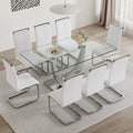 Table And Chair Set. Large Modern Rectangular Table With Glass Top And Silver Metal Legs. Furnished With Soft And Comfortable Pu Chairs With Faux Leather Upholstered Seats And Silver Metal Legs. White Silver Seats 8 Glass Metal