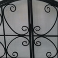 43 Inches 2 Door Iron Fireplace Screen, Mesh Design, Scrollwork, Black Black Iron