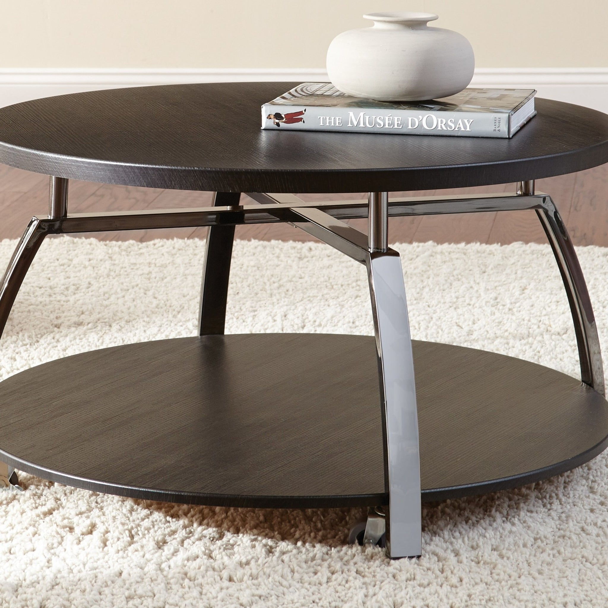 Elegant Table Collection Soft Round Shapes, Silvershield Laminate Tops Black Nickel Base, Aggressive Profile Cocktail Table With Casters Black Solid Wood Mdf