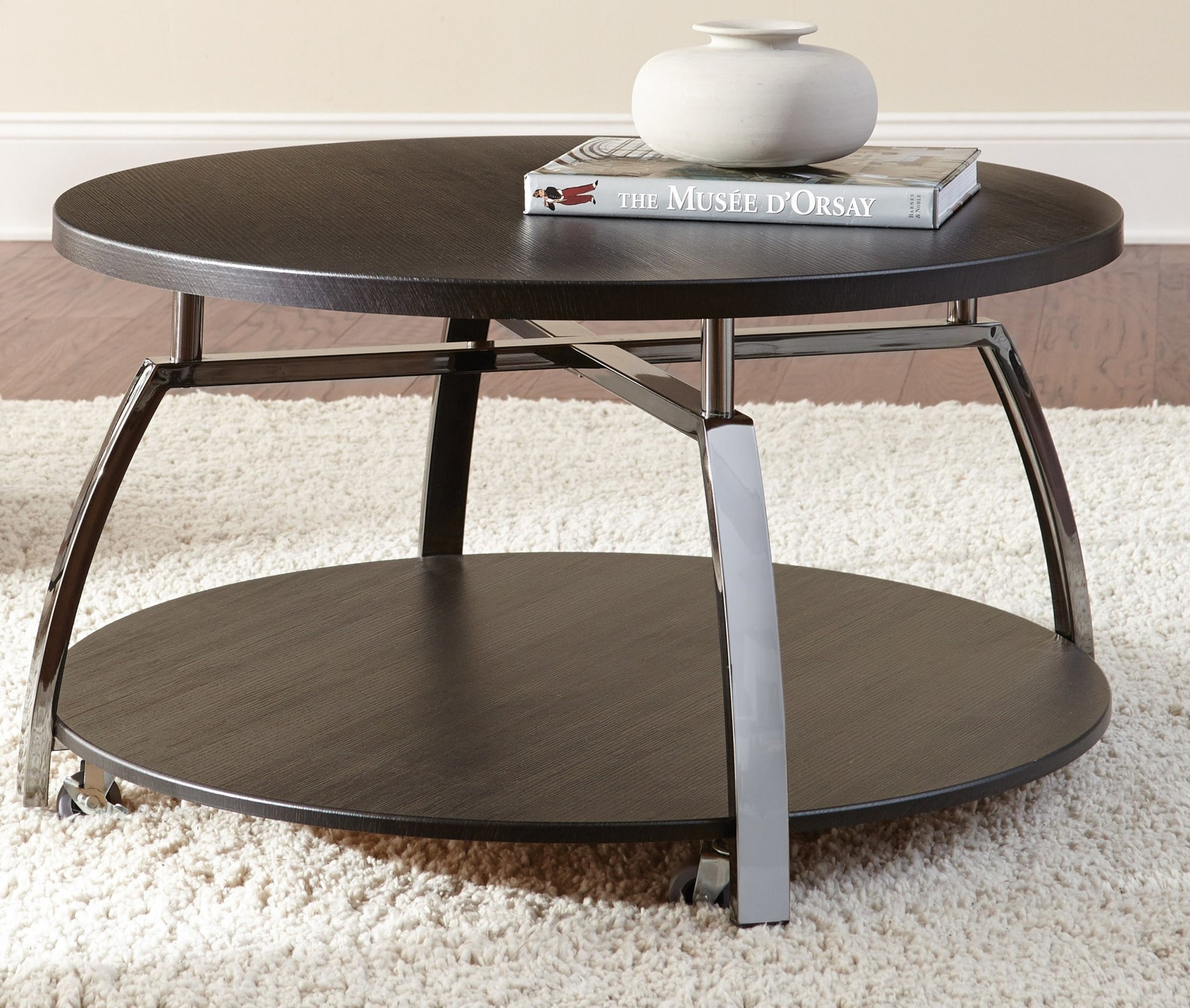 Elegant Table Collection Soft Round Shapes, Silvershield Laminate Tops Black Nickel Base, Aggressive Profile Cocktail Table With Casters Black Solid Wood Mdf