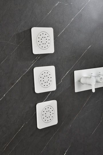 Shower System With Shower Head, Hand Shower, Slide Bar, Bodysprays, Shower Arm, Hose, Valve Trim, And Lever Handles White Brass