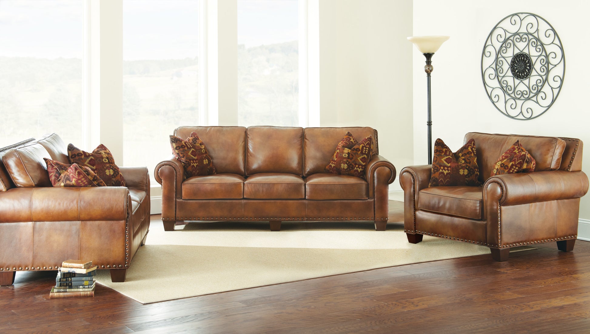 Rustic Styled Leather Sofa Premium Construction, Top Grain Leather Eight Way Hand Tied Springs, Nail Head Trim, Contrasting Pillows Tan Foam Leather 3 Seat