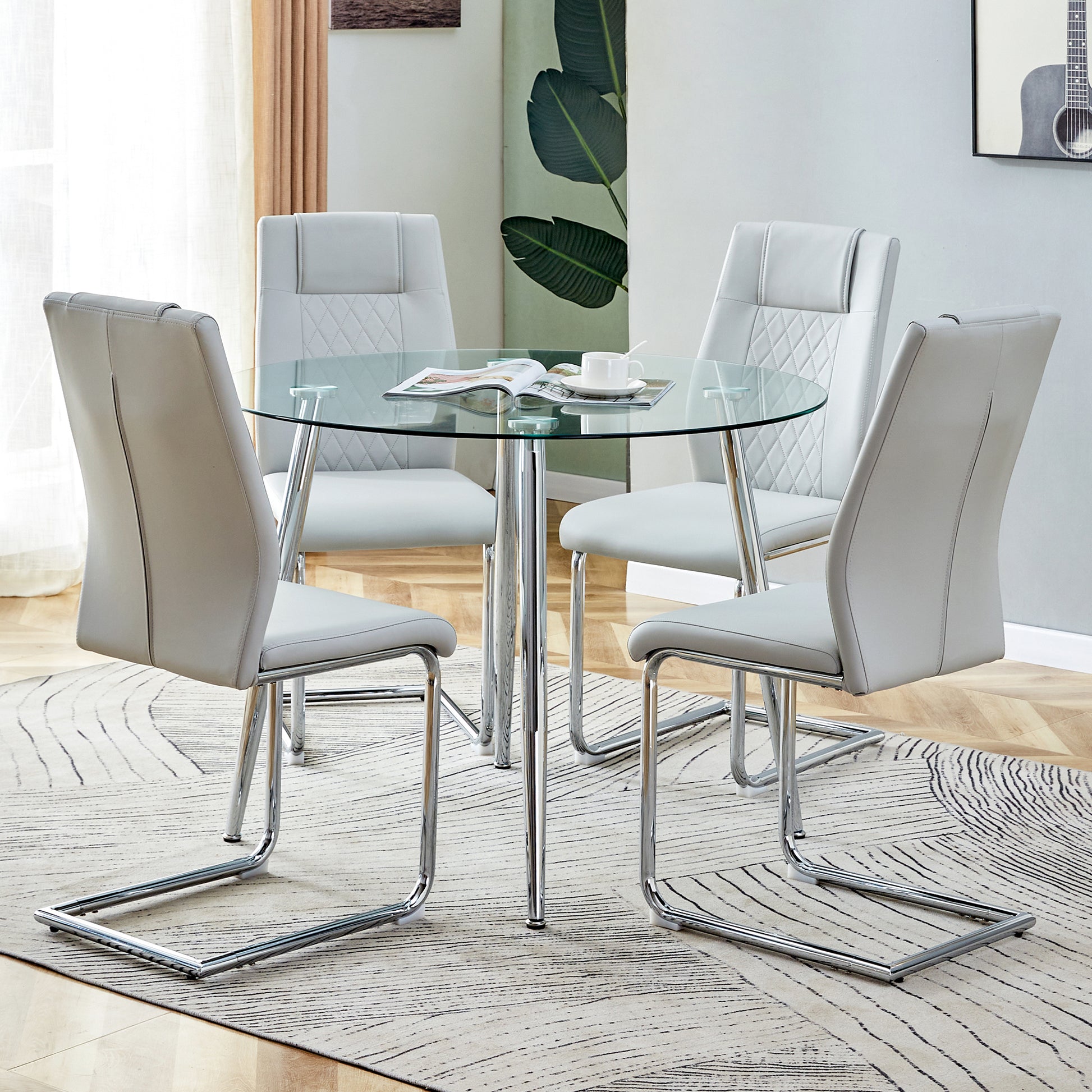 Table And Chair Set. 1 Table 4 Light Gray Chairs Round Dining Table With A 40 Inch Diameter Glass Tabletop And Silver Plated Metal Legs. 4 Light Gray Pu Chairs Dt 1164 001 Transparent Seats 4 Glass