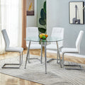 Table And Chair Set. 1 Table 4 Chairs Set A Circular Dining Table With A 40 Inch Diameter Glass Tabletop And Electroplated Metal Legs. 4 White Pu Chairs Dt 1164 001 Transparent Seats 4 Glass