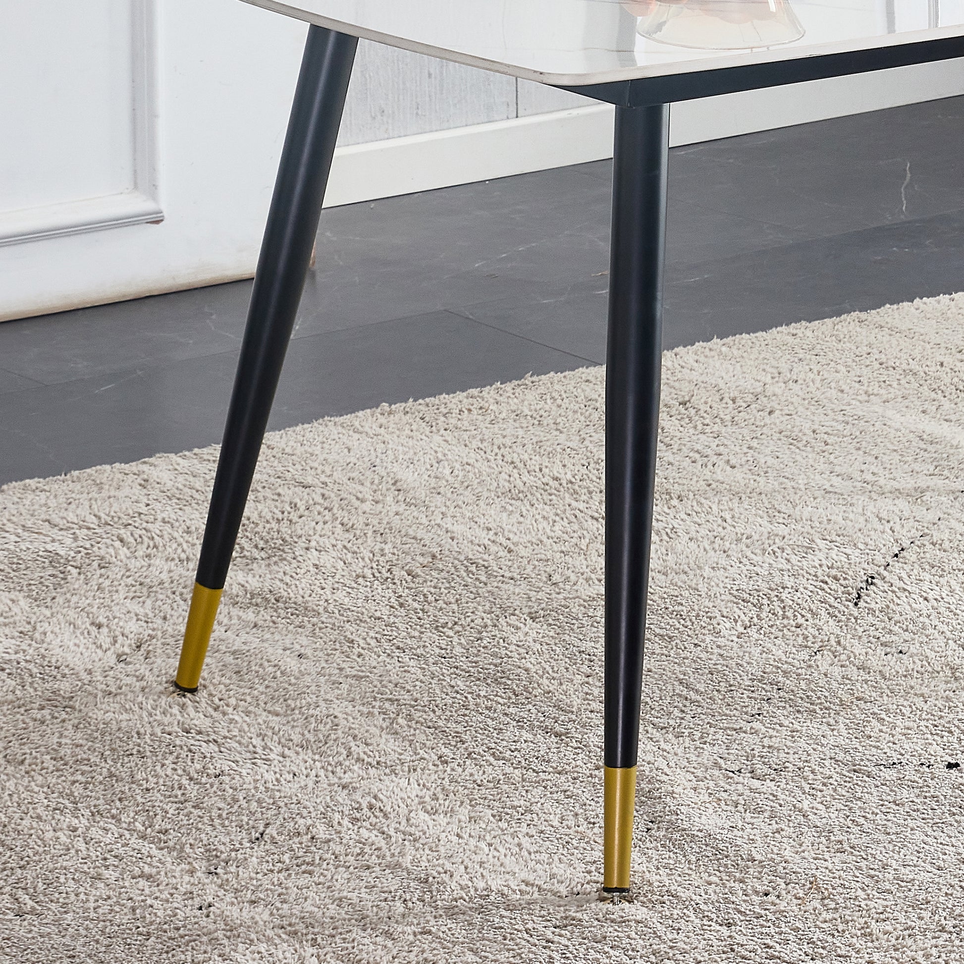 Table And Chair Set. White Imitation Marble Patterned Burnt Stone Tabletop With Black Metal Legs. Orange Deep Gray Dual Tone Pu Leather Backrest And Black Metal Leg Chair. 1 Table And 4 Chairs 001 007 White Sintered Stone