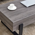 A Rustic Gray Wood Grain Mdf Coffee Table With Black Metal Legs An Elegant Space In Natural Wood Tones Grey Mdf