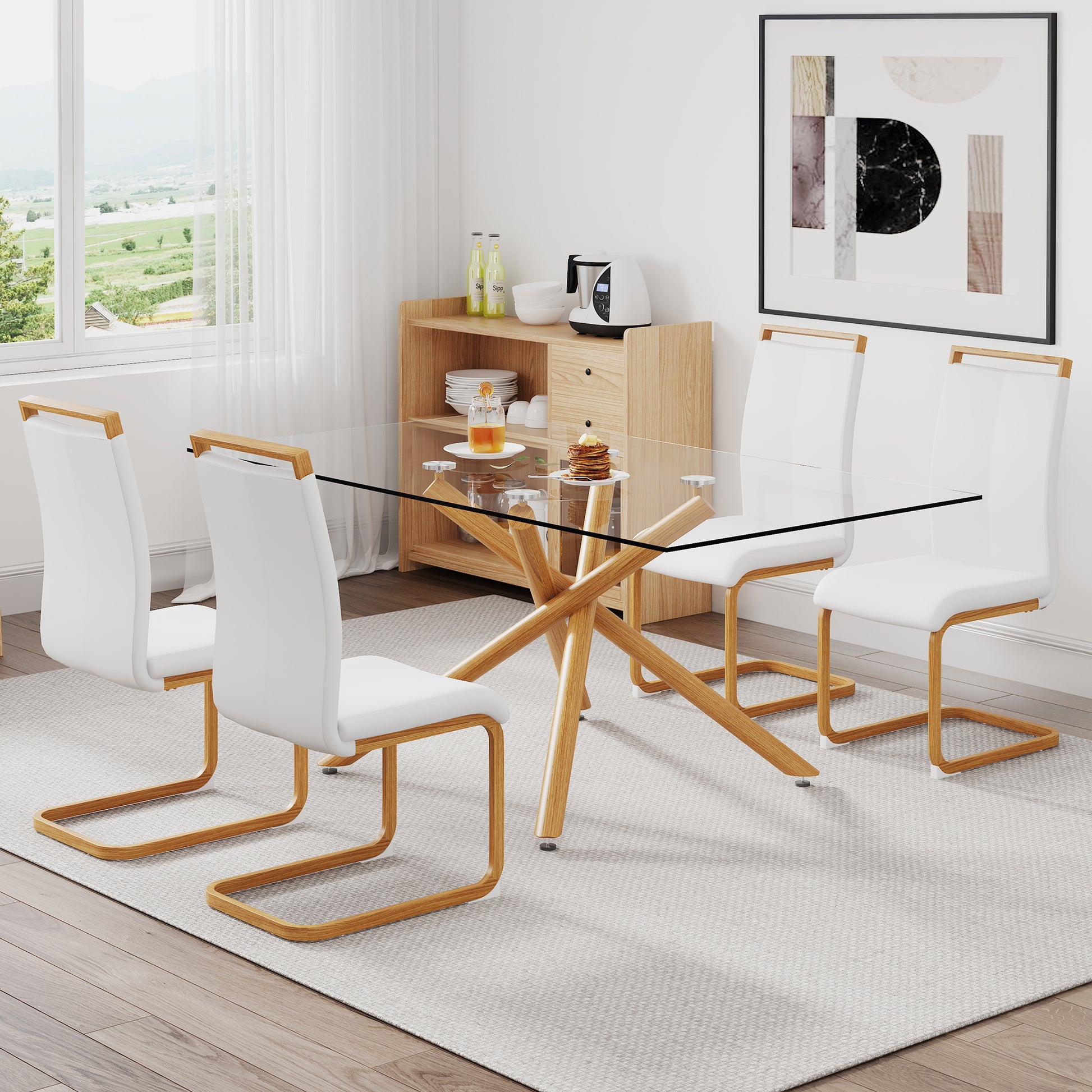 A table with four chairs. Glass dining table with 0.39 transparent-glass