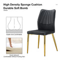 Four Black Dining Chairs. A Medieval Modern Chair Made Of Pu Material With Soft Cushions, Equipped With Golden Metal Legs. Suitable For Restaurants And Living Rooms Black Pu