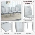 Four Light Gray Dining Chairs. A Medieval Modern Chair Made Of Pu Material With Soft Cushions And Silver Metal Legs. Suitable For Restaurants And Living Rooms Light Gray Pu