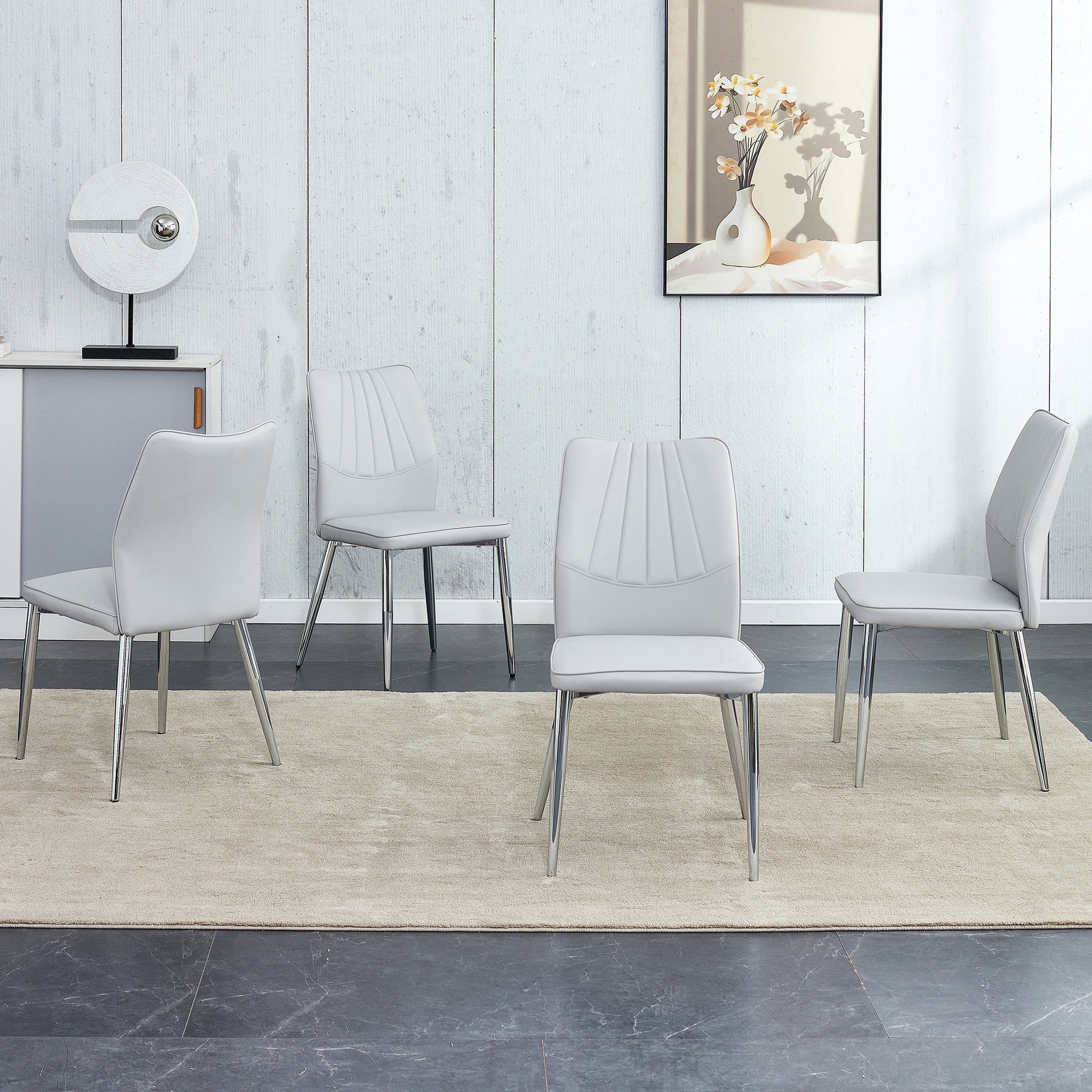 Four Light Gray Dining Chairs. A Medieval Modern Chair Made Of Pu Material With Soft Cushions And Silver Metal Legs. Suitable For Restaurants And Living Rooms Light Gray Pu
