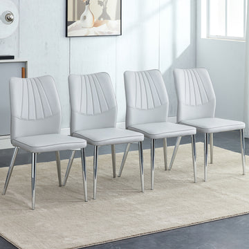Four Light Gray Dining Chairs. A Medieval Modern Chair Made Of Pu Material With Soft Cushions And Silver Metal Legs. Suitable For Restaurants And Living Rooms Light Gray Pu