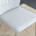 Four Light Gray Dining Chairs. A Medieval Modern Chair Made Of Pu Material With Soft Cushions And Silver Metal Legs. Suitable For Restaurants And Living Rooms Light Gray Pu
