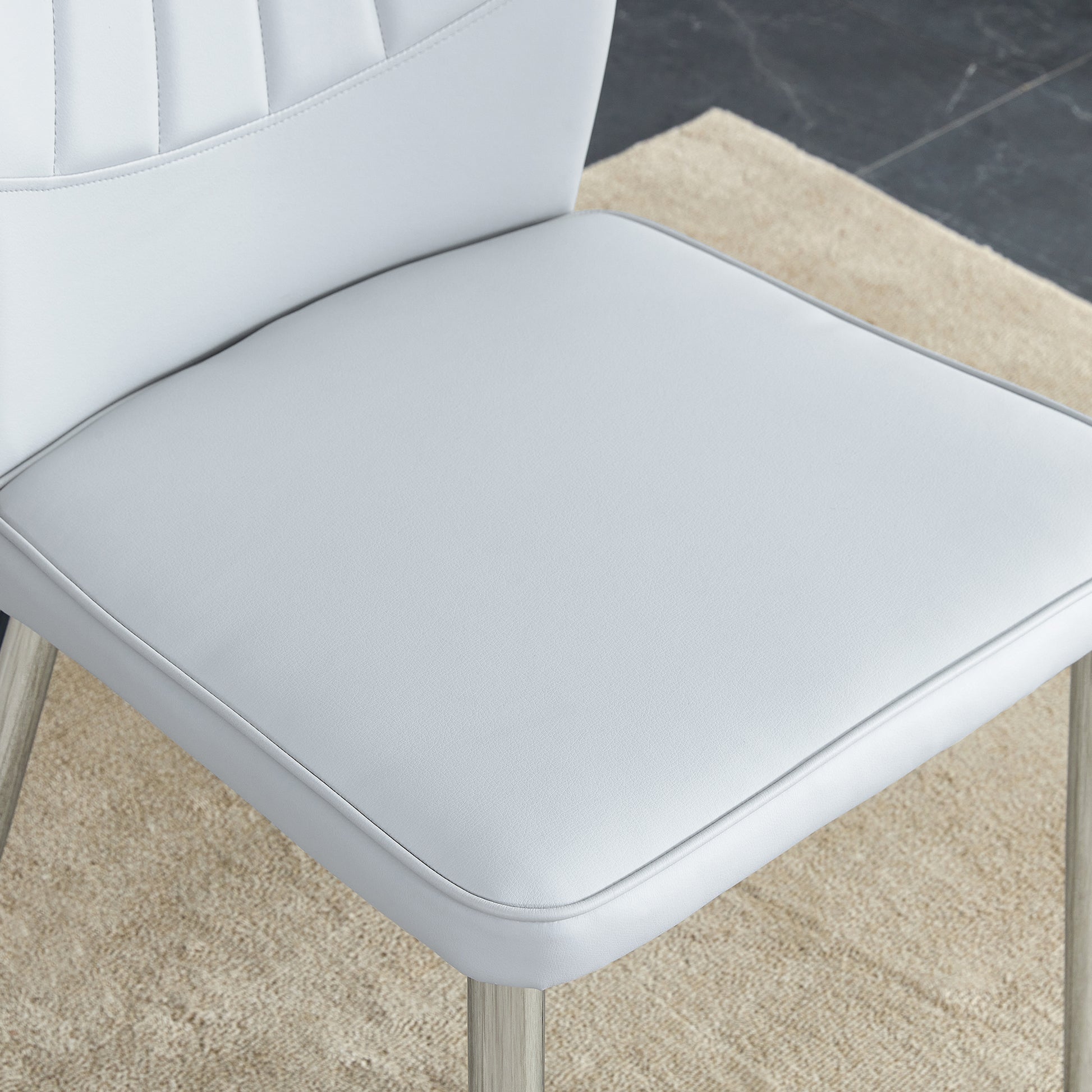 Four Light Gray Dining Chairs. A Medieval Modern Chair Made Of Pu Material With Soft Cushions And Silver Metal Legs. Suitable For Restaurants And Living Rooms Light Gray Pu
