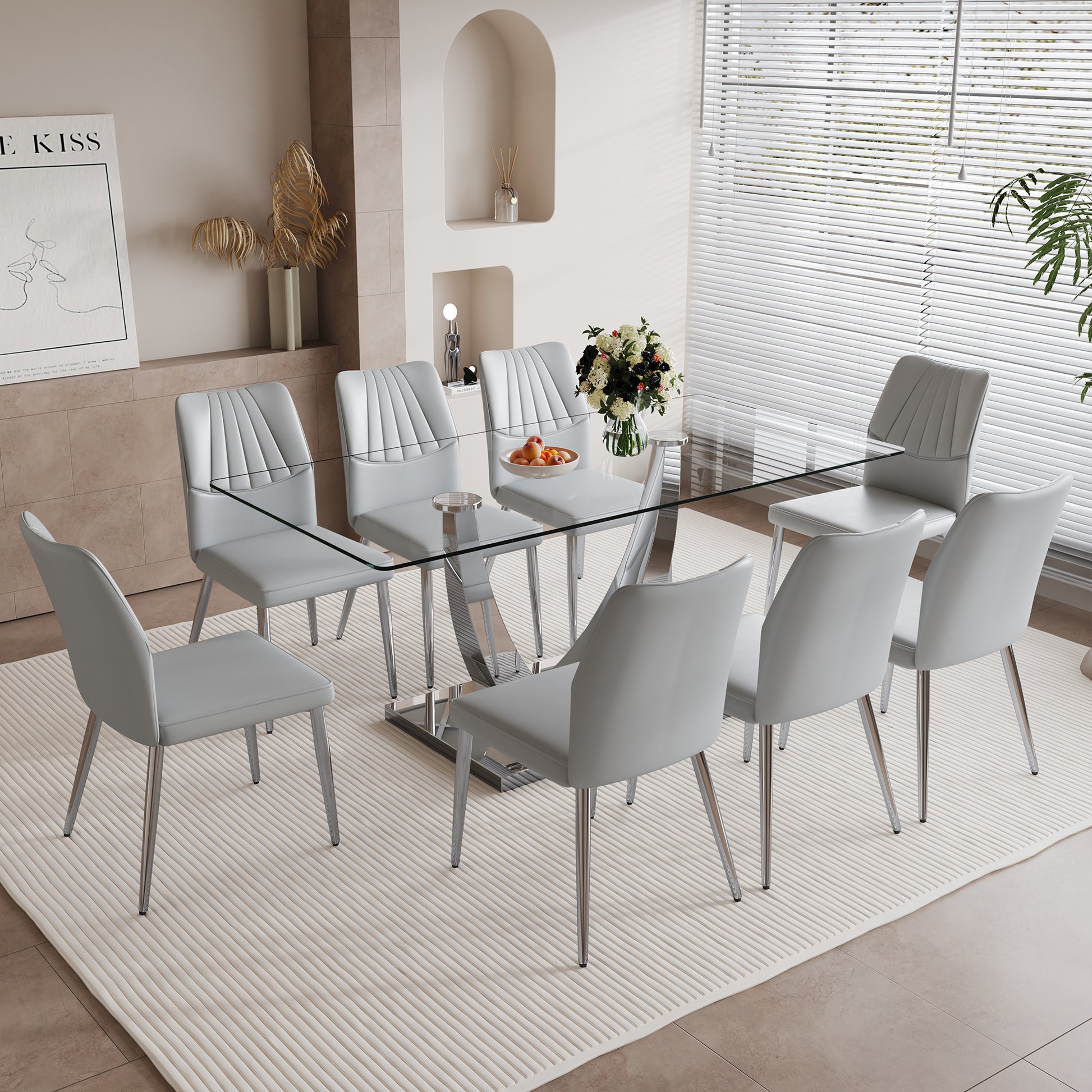 Table And Chair Set.Contemporary, Minimalist Rectangular Dining Table Featuring A Clear Tempered Glass Top And Sleek Silver Legs. Paried With Chairs Made Of Pu Material Cushion And Silver Metal Legs. Light Gray Seats 8 Glass Metal