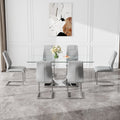 Table And Chair Set.Contemporary, Minimalist Rectangular Dining Table Featuring A Clear Tempered Glass Top And Sleek Silver Legs. Paried With Chairs Made Of Pu Material Cushion And Silver Metal Legs. Gray Seats 6 Glass Metal