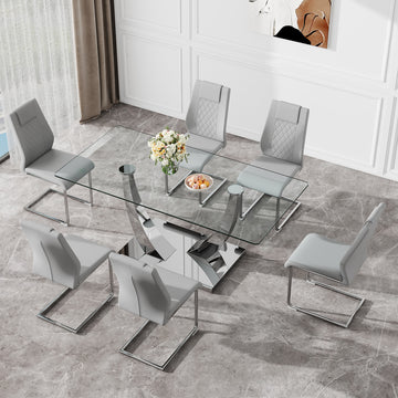 Table And Chair Set.Contemporary, Minimalist Rectangular Dining Table Featuring A Clear Tempered Glass Top And Sleek Silver Legs. Paried With Chairs Made Of Pu Material Cushion And Silver Metal Legs. Gray Seats 6 Glass Metal