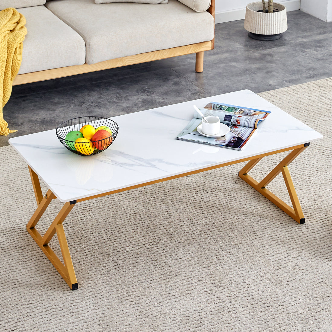 A Coffee Table Made Of Rock Slab Material, With A Smooth And Natural Surface That Complements The Modern Design Of The Golden Metal Legs, Making It Suitable For Living Rooms Of All Sizes.47*23.6 White Gold Sintered Stone