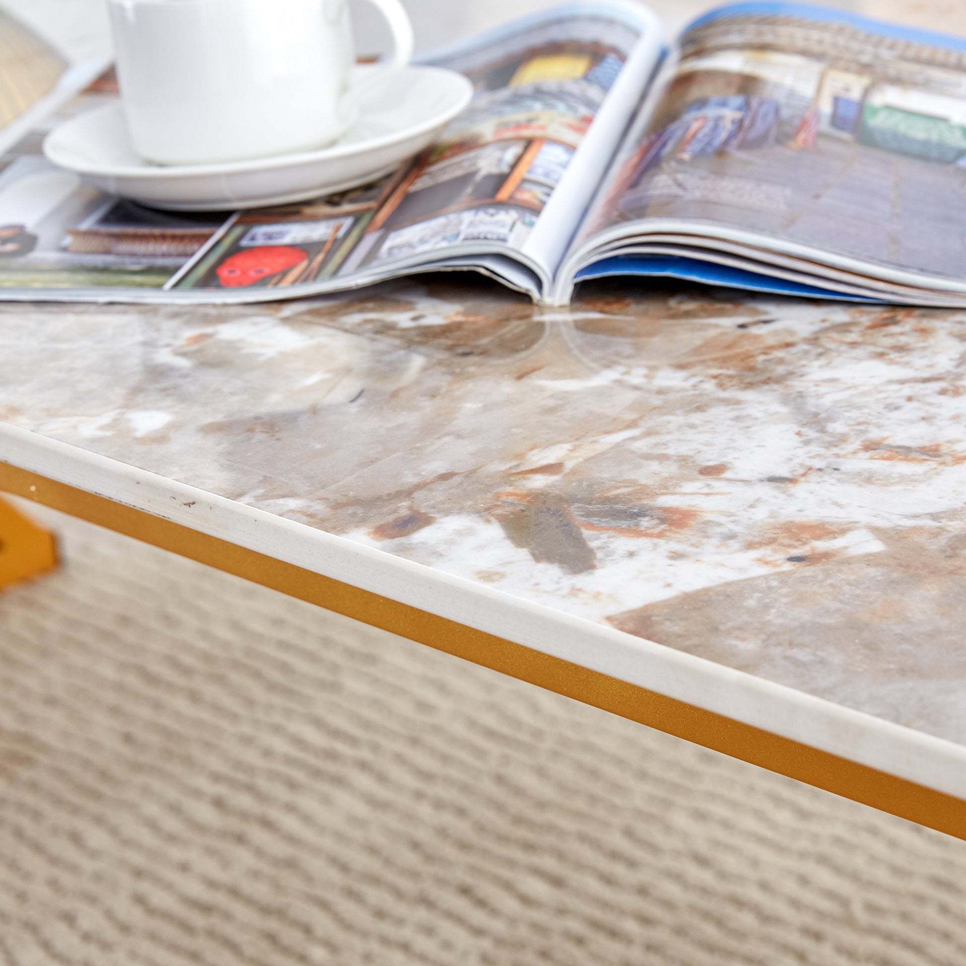 A Coffee Table Is Made Of Rock Slab Material, With A Natural And Smooth Marble Pattern On The Surface, Which Complements The Modern Design Of The Golden Metal Legs And Adds A Touch Of Fashion.47*23.6 Gold Sintered Stone