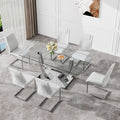 Table And Chair Set.Contemporary, Minimalist Rectangular Dining Table Featuring A Clear Tempered Glass Top And Sleek Silver Legs. Paried With Chairs Made Of Pu Material Cushion And Silver Metal Legs. White Seats 6 Glass Metal