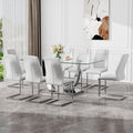 Table And Chair Set.Contemporary, Minimalist Rectangular Dining Table Featuring A Clear Tempered Glass Top And Sleek Silver Legs. Paried With Chairs Made Of Pu Material Cushion And Silver Metal Legs. White Seats 8 Glass Metal