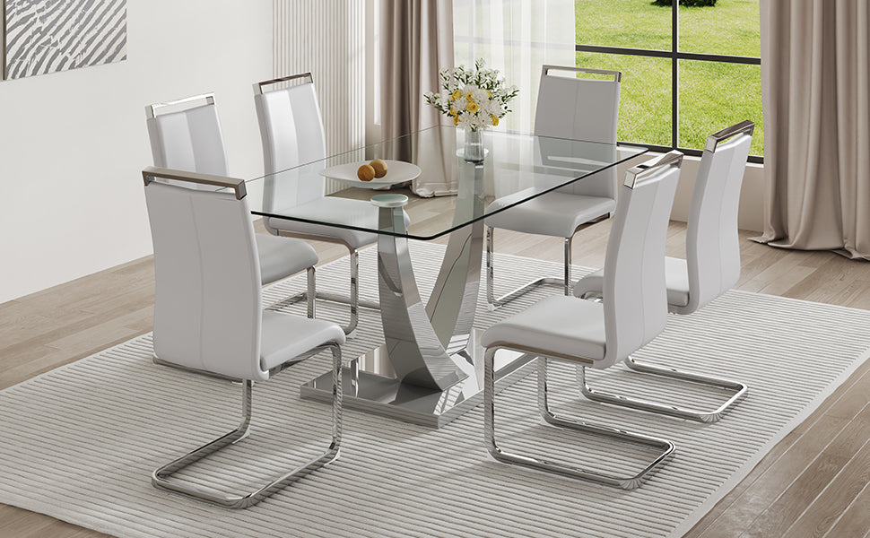 Table And Chair Set. Large Modern Rectangular Table With Glass Top And Silver Metal Legs. Furnished With Soft And Comfortable Pu Chairs With Faux Leather Upholstered Seats And Silver Metal Legs. Gray Silver Seats 6 Glass Metal