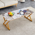 A Coffee Table Is Made Of Rock Slab Material, With A Natural And Smooth Marble Pattern On The Surface, Which Complements The Modern Design Of The Golden Metal Legs And Adds A Touch Of Fashion.47*23.6 Gold Sintered Stone