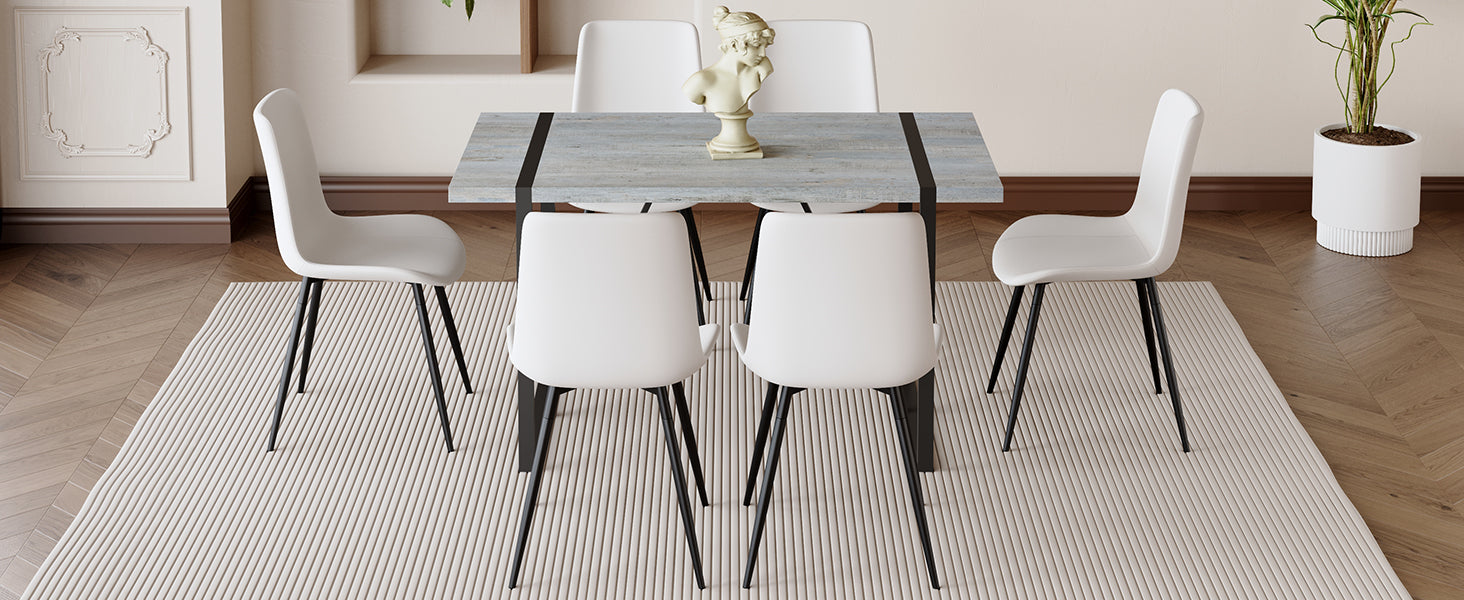 Table And Chair Set. Modern Minimalist Grey Marble Textured Mdf Dining Table With Metal Frame. Comes With 6 Chairs With Pu Cushions And Black Metal Legs. White Seats 6 Mdf Metal