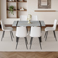 Table And Chair Set. Modern Minimalist Grey Marble Textured Mdf Dining Table With Metal Frame. Comes With 6 Chairs With Pu Cushions And Black Metal Legs. White Seats 6 Mdf Metal