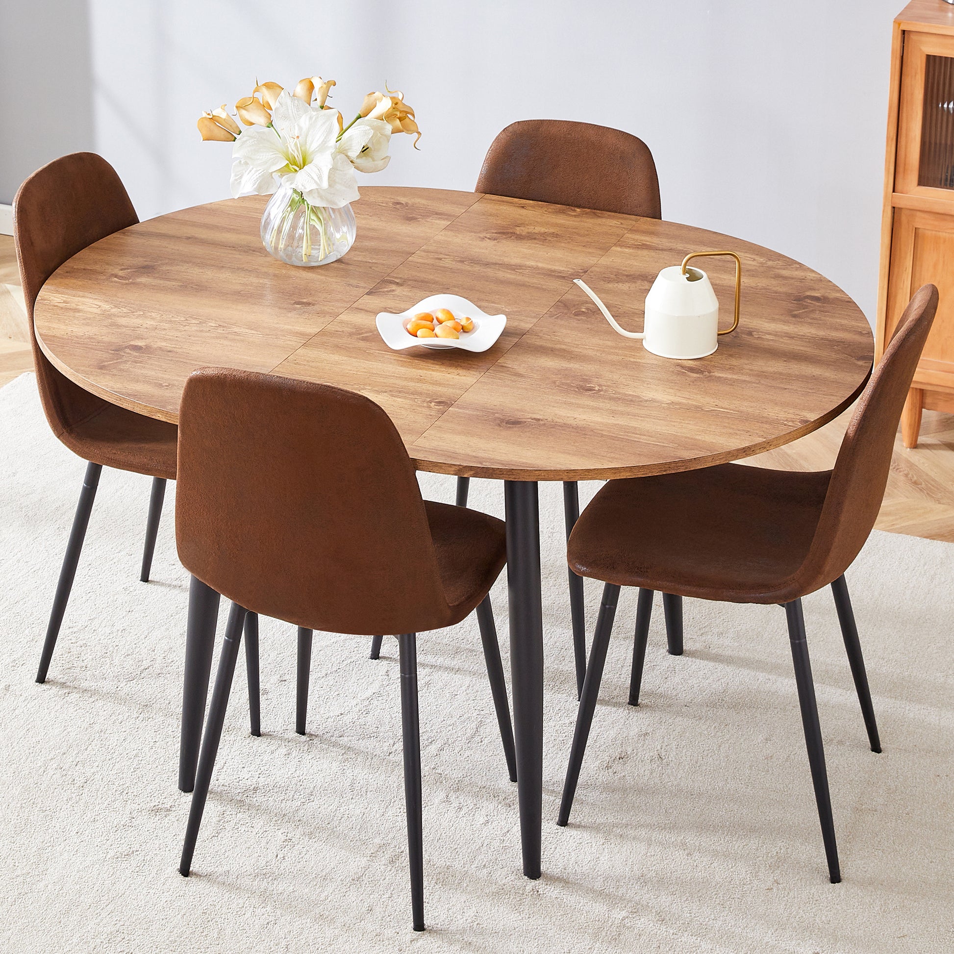 Table And Chair Set.Modern Extendable Mdf Dining Table.The Table Has A Telescopic Design, Suitable For Gatherings Of Different Size.Paired With 4 Chairs With Soft Suede Cushions And Black Metal