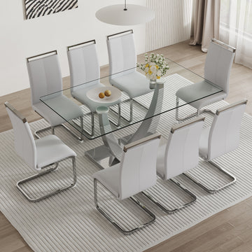 Table And Chair Set. Large Modern Rectangular Table With Glass Top And Silver Metal Legs. Furnished With Soft And Comfortable Pu Chairs With Faux Leather Upholstered Seats And Silver Metal Legs. Gray Silver Seats 6 Glass Metal