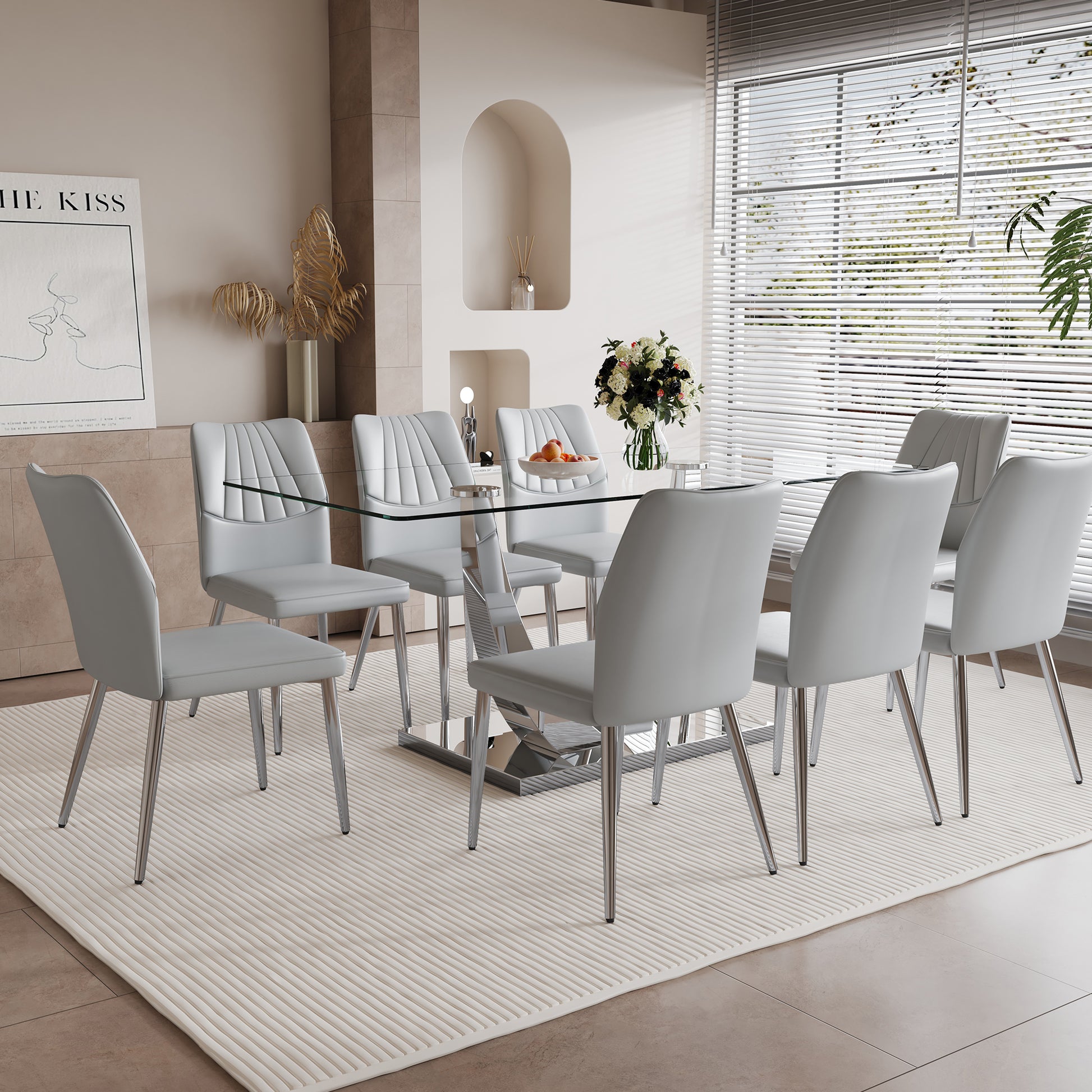 Table And Chair Set.Contemporary, Minimalist Rectangular Dining Table Featuring A Clear Tempered Glass Top And Sleek Silver Legs. Paried With Chairs Made Of Pu Material Cushion And Silver Metal Legs. Light Gray Seats 8 Glass Metal