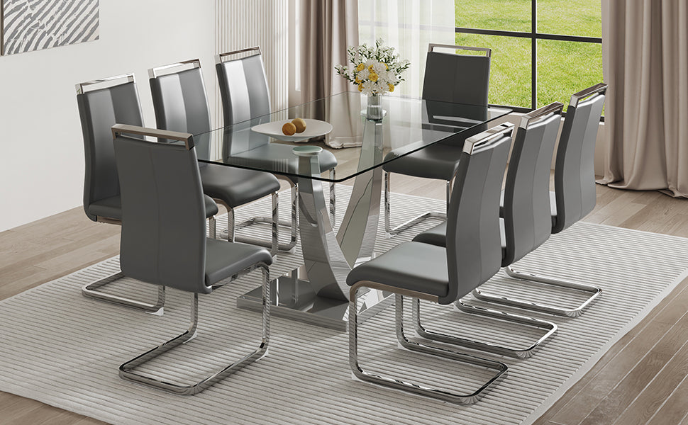 Table And Chair Set. Large Modern Rectangular Table With Glass Top And Silver Metal Legs. Furnished With Soft And Comfortable Pu Chairs With Faux Leather Upholstered Seats And Silver Metal Legs. Gray Silver Seats 8 Glass Metal