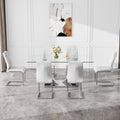 Table And Chair Set.Contemporary, Minimalist Rectangular Dining Table Featuring A Clear Tempered Glass Top And Sleek Silver Legs. Paried With Chairs Made Of Pu Material Cushion And Silver Metal Legs. White Seats 6 Glass Metal