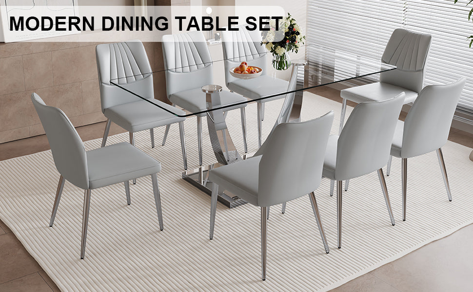 Table And Chair Set.Contemporary, Minimalist Rectangular Dining Table Featuring A Clear Tempered Glass Top And Sleek Silver Legs. Paried With Chairs Made Of Pu Material Cushion And Silver Metal Legs. Light Gray Seats 8 Glass Metal