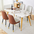 Table And Chair Set.Modern Minimalist Dining Table. White Imitation Marble Pattern Sintered Stone Desktop With Golden Metal Legs.Paried With 4 Comfortable Chairs With Pu Seats And Black Metal Legs.