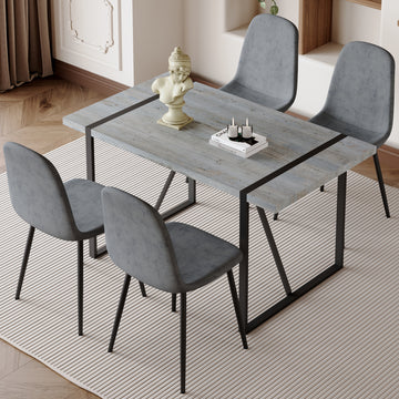 Table And Chair Set. A Minimalist Retro Rectangular Dining Table With A Specially Textured Top And Black Metal Legs, Paired With 4 Soft Chairs And Black Metal Legs, Showcases A Beautiful Home Style.