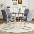 A Modern Minimalist Round Transparent Tempered Glass Table With Silver Metal Legs And 4 Modern Pu Leather High Backed Dining Chairs For A Luxurious Experience. Gray Seats 4 Glass Metal