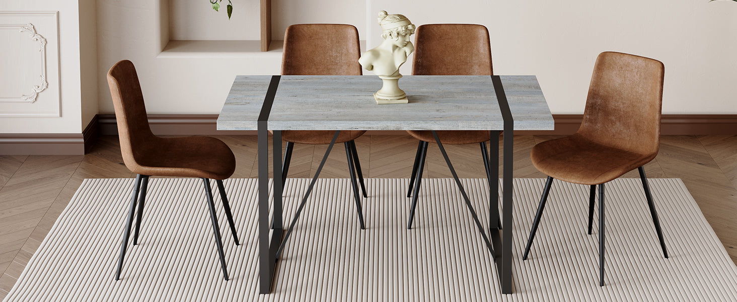 Table And Chair Set. Modern Minimalist Grey Marble Textured Mdf Dining Table With Metal Frame. Paired With 4 Chairs With Soft Suede Cushions And Black Metal Legs. Brown Seats 4 Mdf Metal