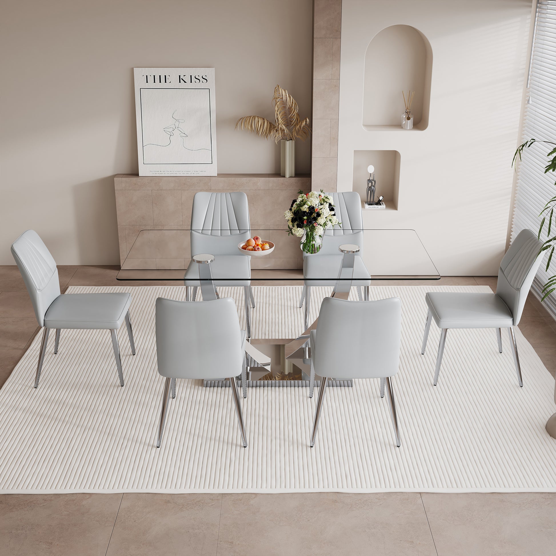 Table And Chair Set.Contemporary, Minimalist Rectangular Dining Table Featuring A Clear Tempered Glass Top And Sleek Silver Legs. Paried With Chairs Made Of Pu Material Cushion And Silver Metal Legs. Light Gray Seats 6 Glass Metal