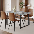 Table And Chair Set. Modern Minimalist Grey Marble Textured Mdf Dining Table With Metal Frame. Paired With 4 Chairs With Soft Suede Cushions And Black Metal Legs. Brown Seats 4 Mdf Metal