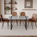 Table And Chair Set. A Minimalist Retro Rectangular Dining Table With A Specially Textured Top And Black Metal Legs, Paired With 4 Soft Chairs And Black Metal Legs, Showcases A Beautiful Home Style.